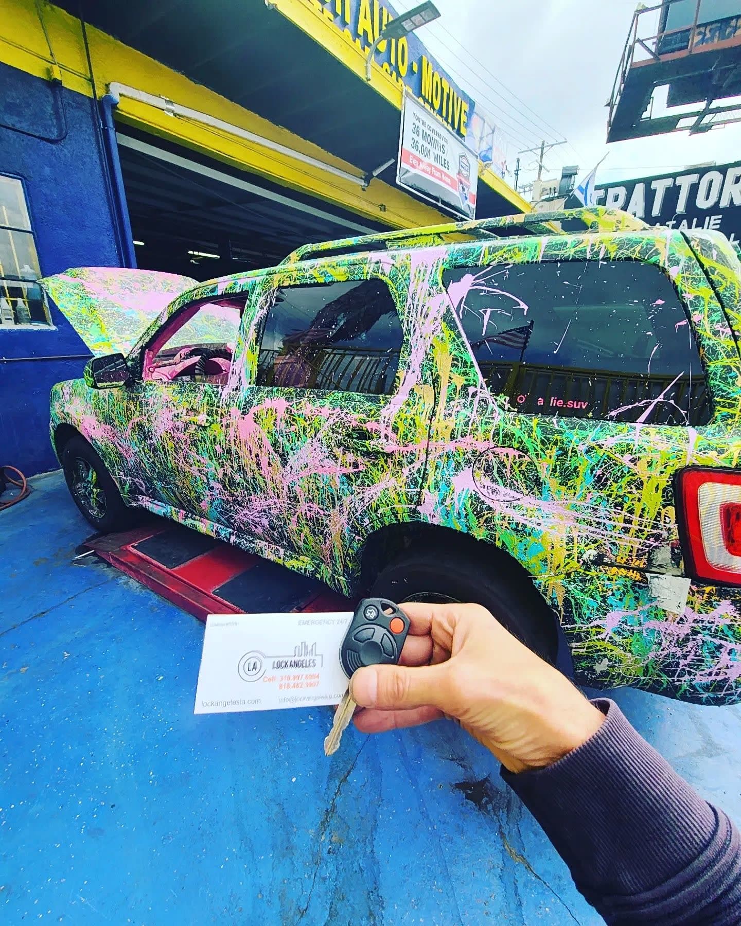 Car key replacement for custom wrapped SUV at Los Angeles auto shop